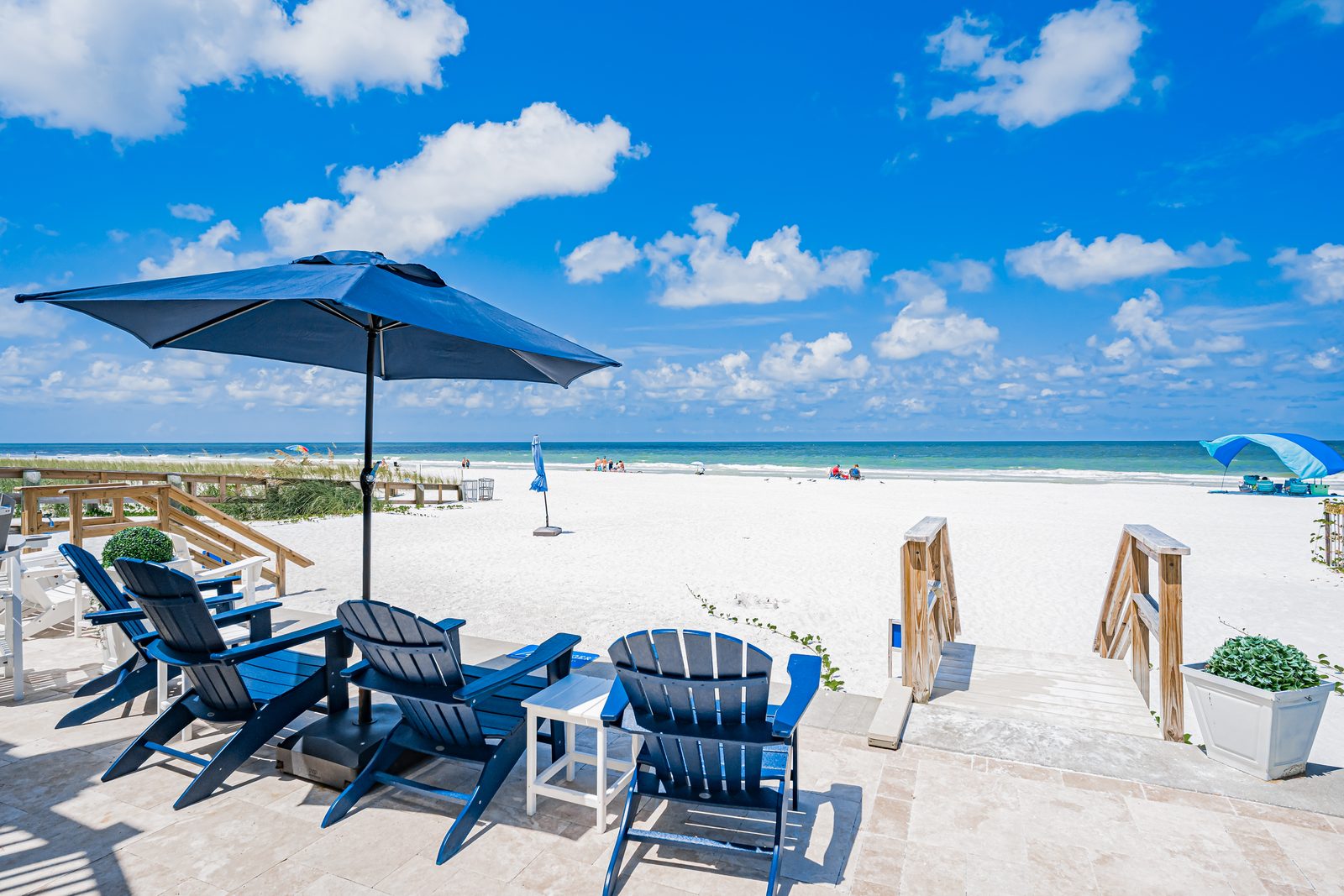 Beach Blues — Adirondack chairs on the patio, steps from the sand